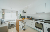 Living area with kitchen inside the Apartment